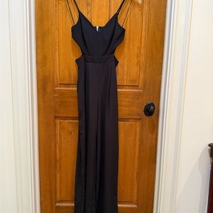 Like New! Stylish Black Jumpsuit with Strappy Design & Cut Out Sides